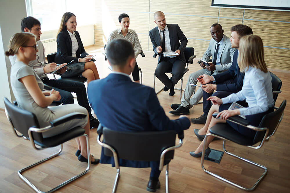 group of agents sitting in a circle of chairs