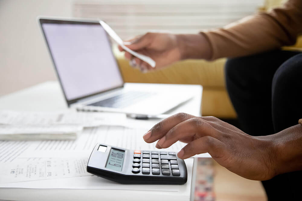 hand and calculator